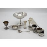 Mixed silver comprising tazza, five napkin rings, two small vases, strainer, egg cup, 800 fish slice