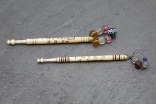 Two Victorian carved bone public hanging souvenir bobbins, inscribed with name and year of