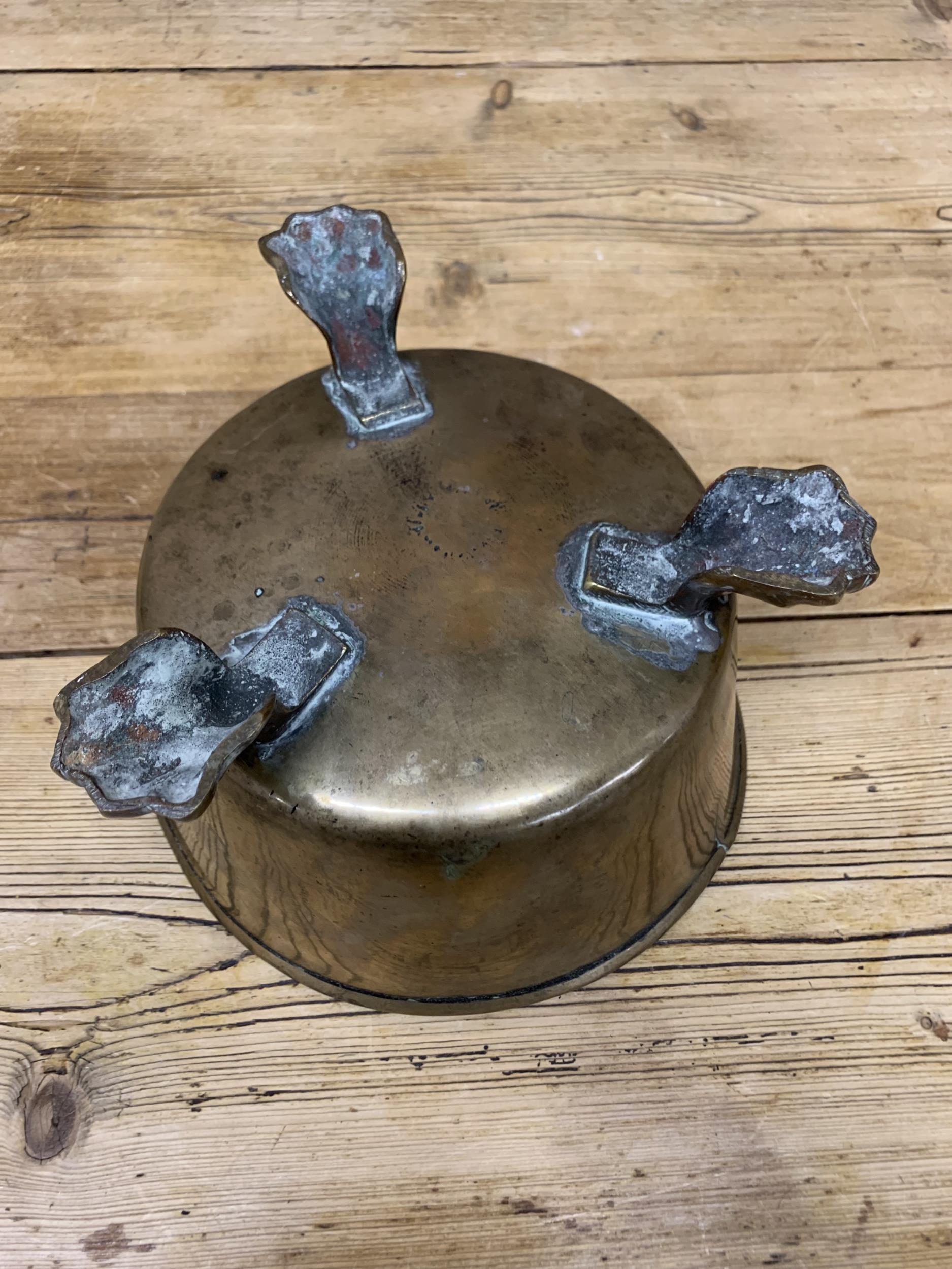 Antique brass bowl with three lion paw feet, H 13cm x D 20cm - Image 3 of 3