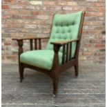 James Shoolbred Arts and Crafts oak reclining arm chair with green button back upholstery, raised