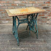 Unusual patinated 'Jones' treadle sewing machine base with modern lacquered mosaic top