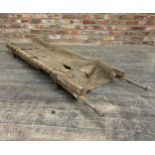 Antique Ferris & Co of Bristol, military folding stretcher, on casters, 185cm long