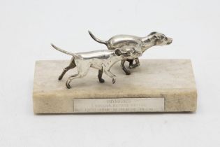 Attractive silver sculpture or paperweight of two silver Foxhounds, on a marble base with plaque