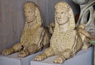 An impressive pair of weathered heavy statues of Egyptian sphinxes, H 64cm x W 120cm x W 35cm