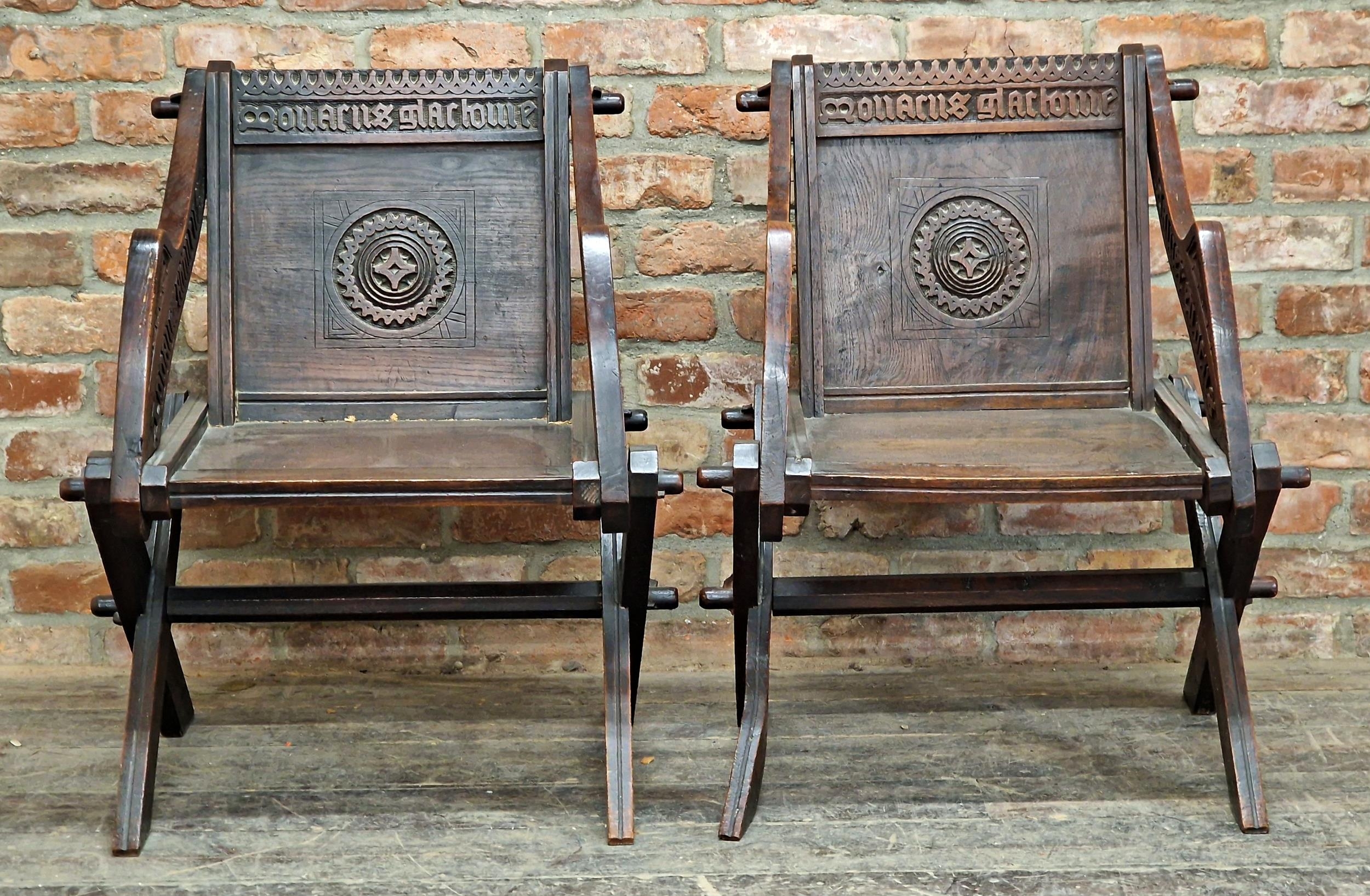 Good quality pair of 19th century carved oak Glastonbury chairs, carved inscriptions to back and