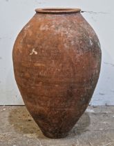 A weathered terracotta amphora, H 61cm