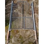 A large pair of painted iron entrance gates complete with posts, H 292cm x W 163cm (including posts)