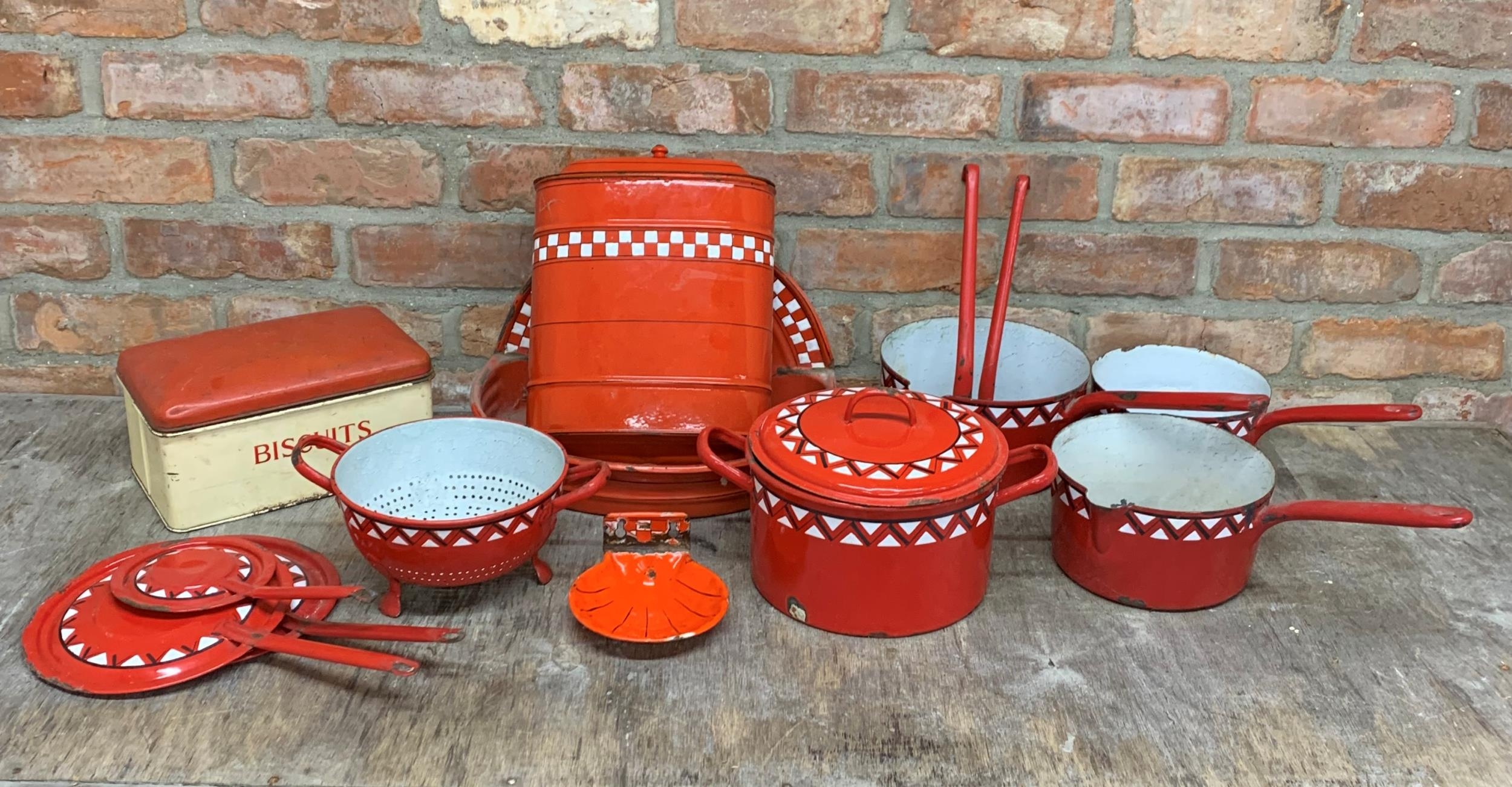 Quantity of vintage red enamel kitchen ware to include saucepans, water tank and soap dish (14)