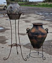 A terracotta urn with twin ring handles on scrolled painted stand, H 75cm x W 45cm, together with