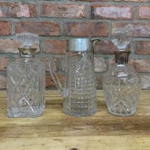 Two silver collared decanters with additional silver rimmed jug (3)