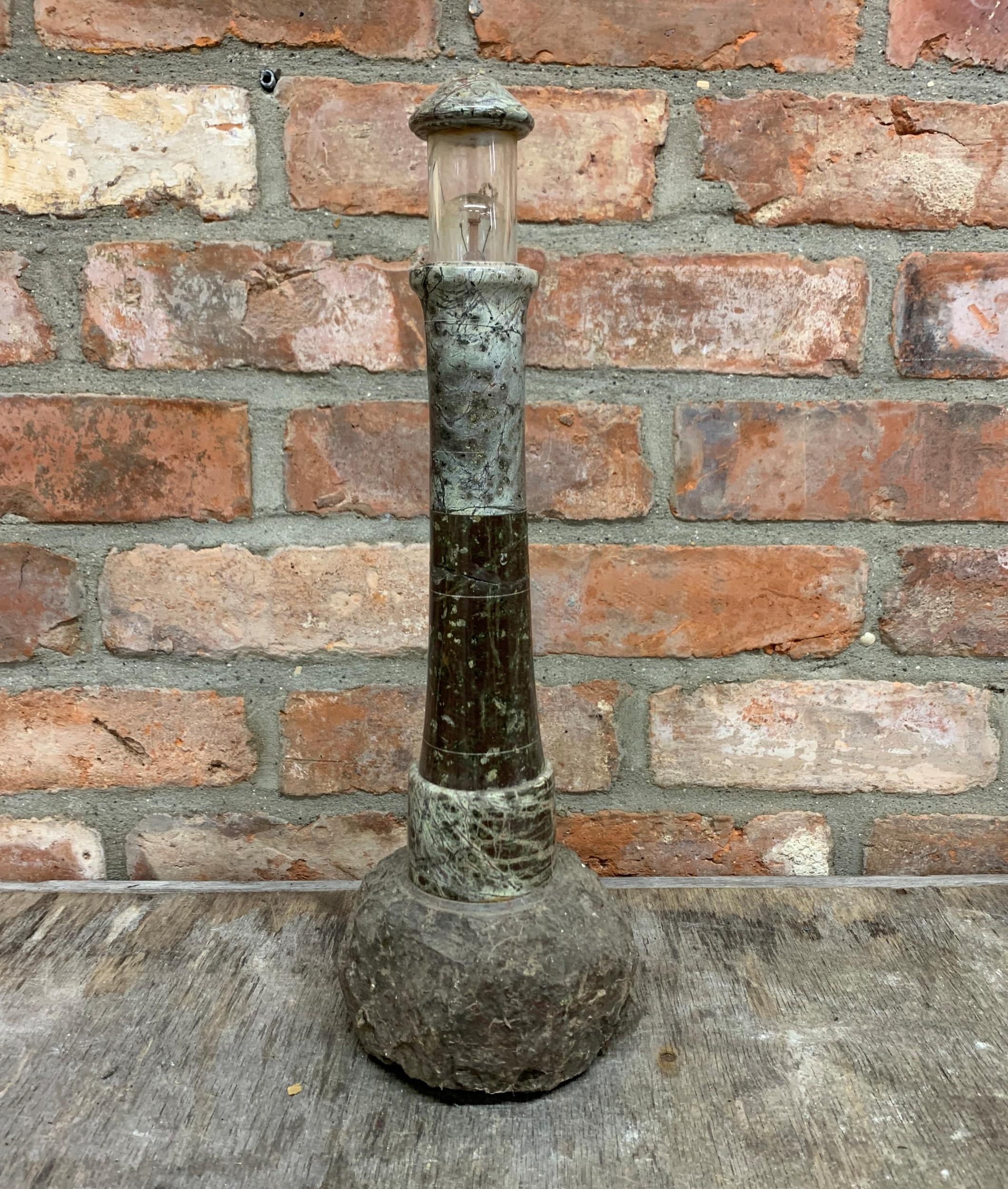 Large Cornish serpentine turned and polished lighthouse lamp on rock base, 45cm