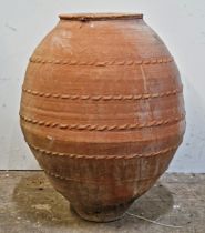 A large terracotta amphora with pressed banding and incised detail, H 70cm