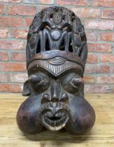 Tribal interest - A carved hardwood Bamileke Helmet Mask from Cameroon, H 60cm