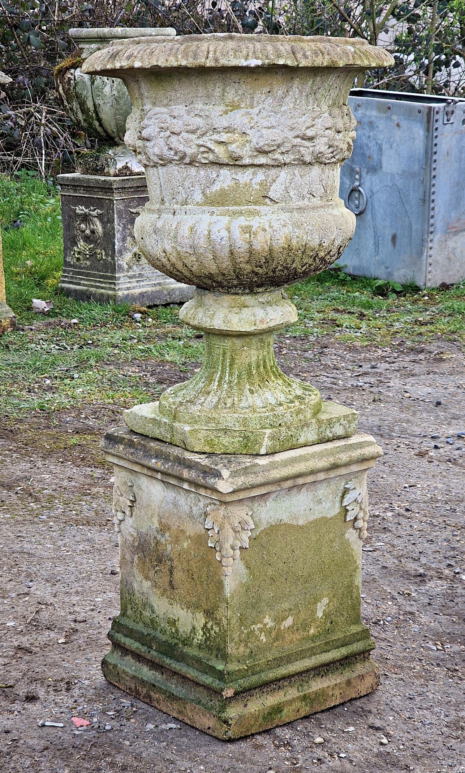 Reconstituted stone Campana shaped garden urn with lobed bowl and flared egg and dart rim raised - Image 2 of 3