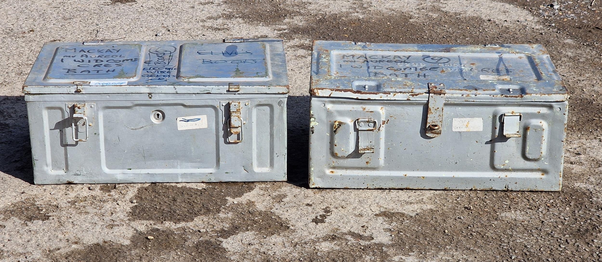 Two tin military trunks with twin carry handles and hinged lids, H 26cm x W 63cm x D 43cm (largest)