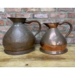 Two large Victorian copper haystack jugs, largest H 37cm