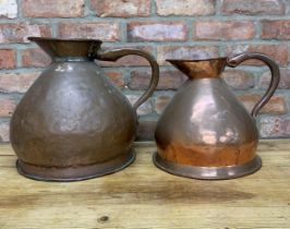 Two large Victorian copper haystack jugs, largest H 37cm