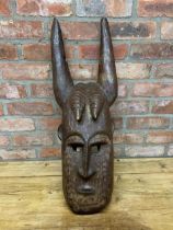 Large antique hand carved wooden African Ivory Coast tribal ceremonial devil horned mask, L 80cm