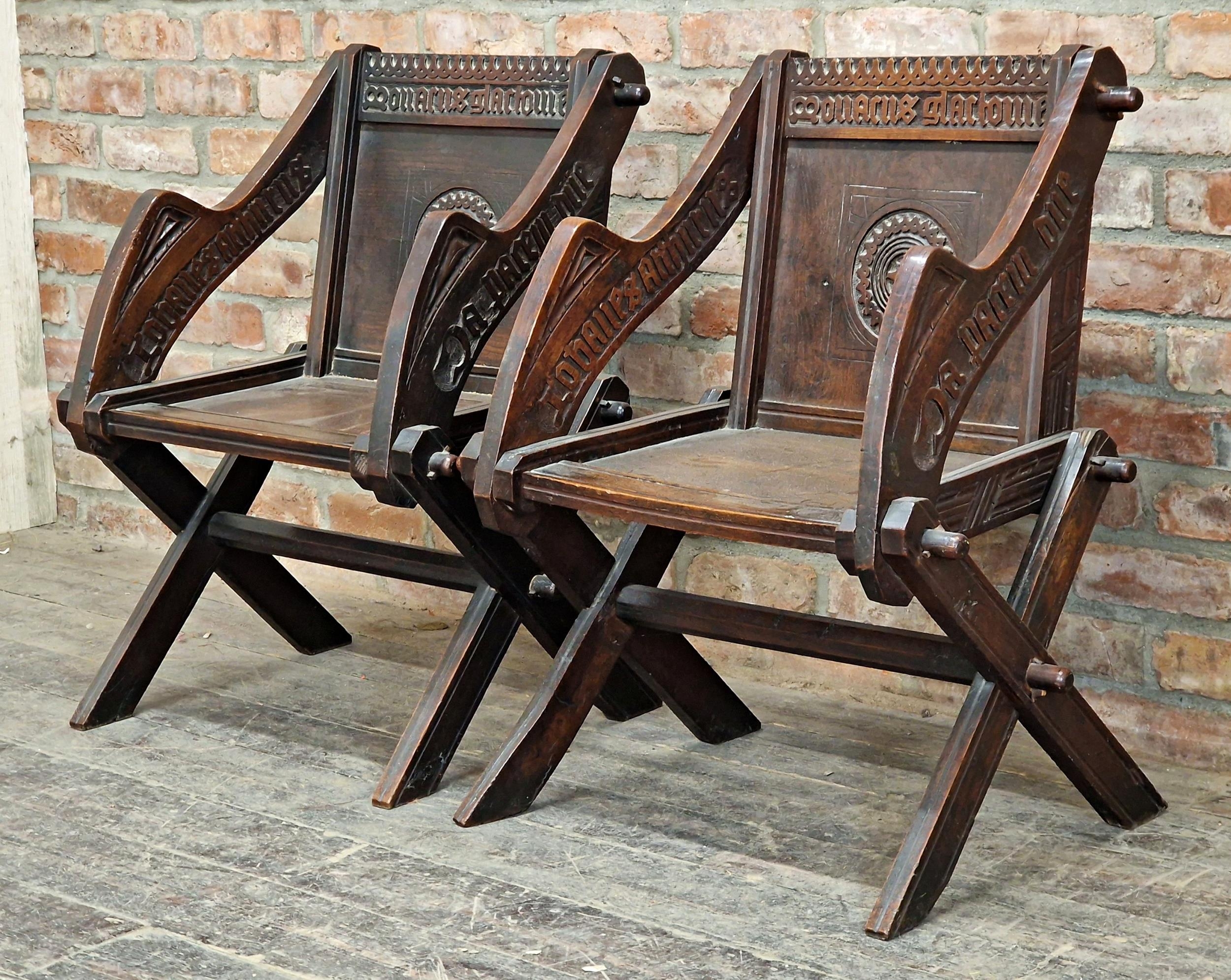 Good quality pair of 19th century carved oak Glastonbury chairs, carved inscriptions to back and - Image 2 of 5