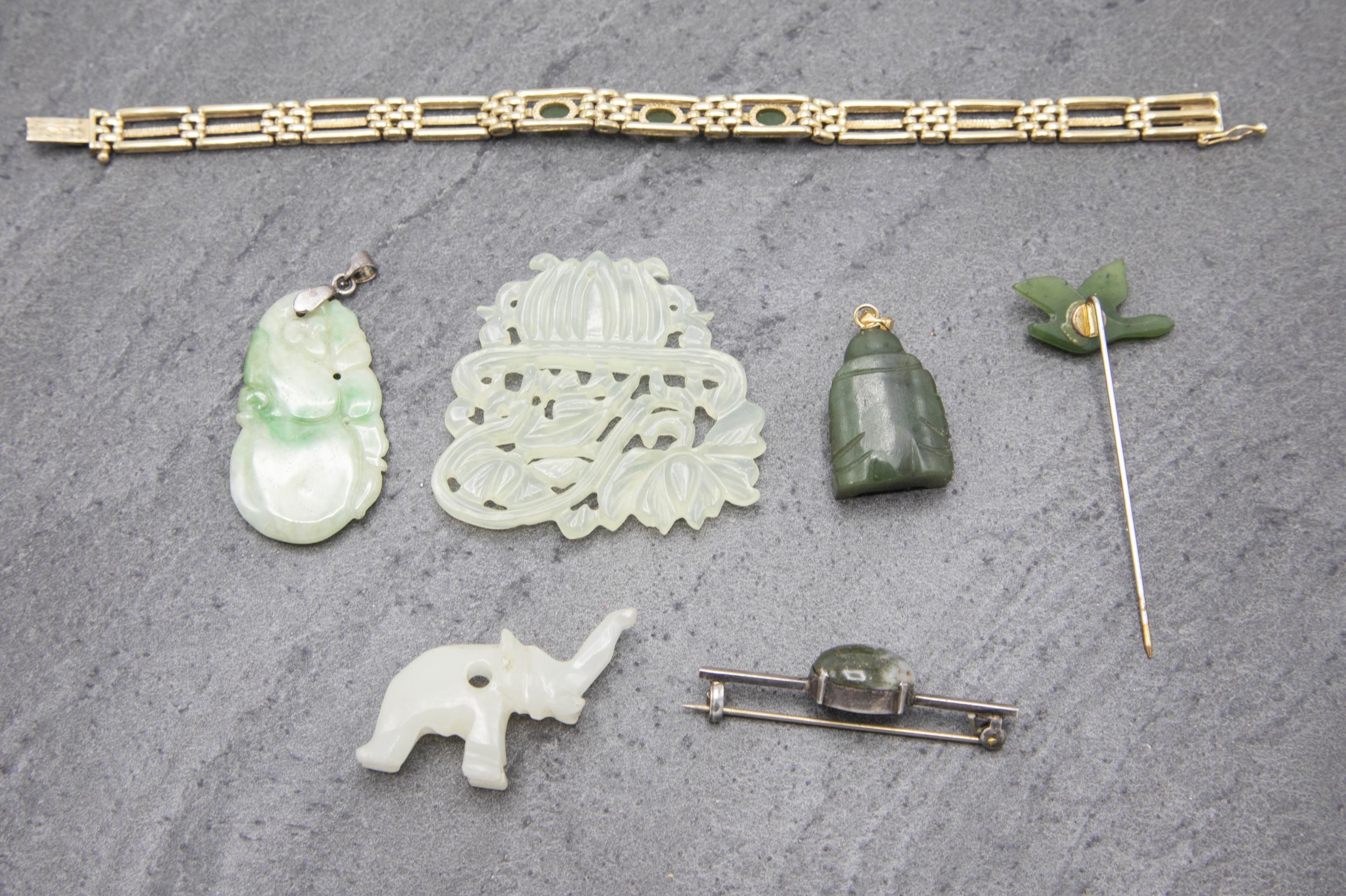 A collection of seven jade jewellery pieces, to include two pendants, bracelet, brooch, stickpin and - Image 2 of 2