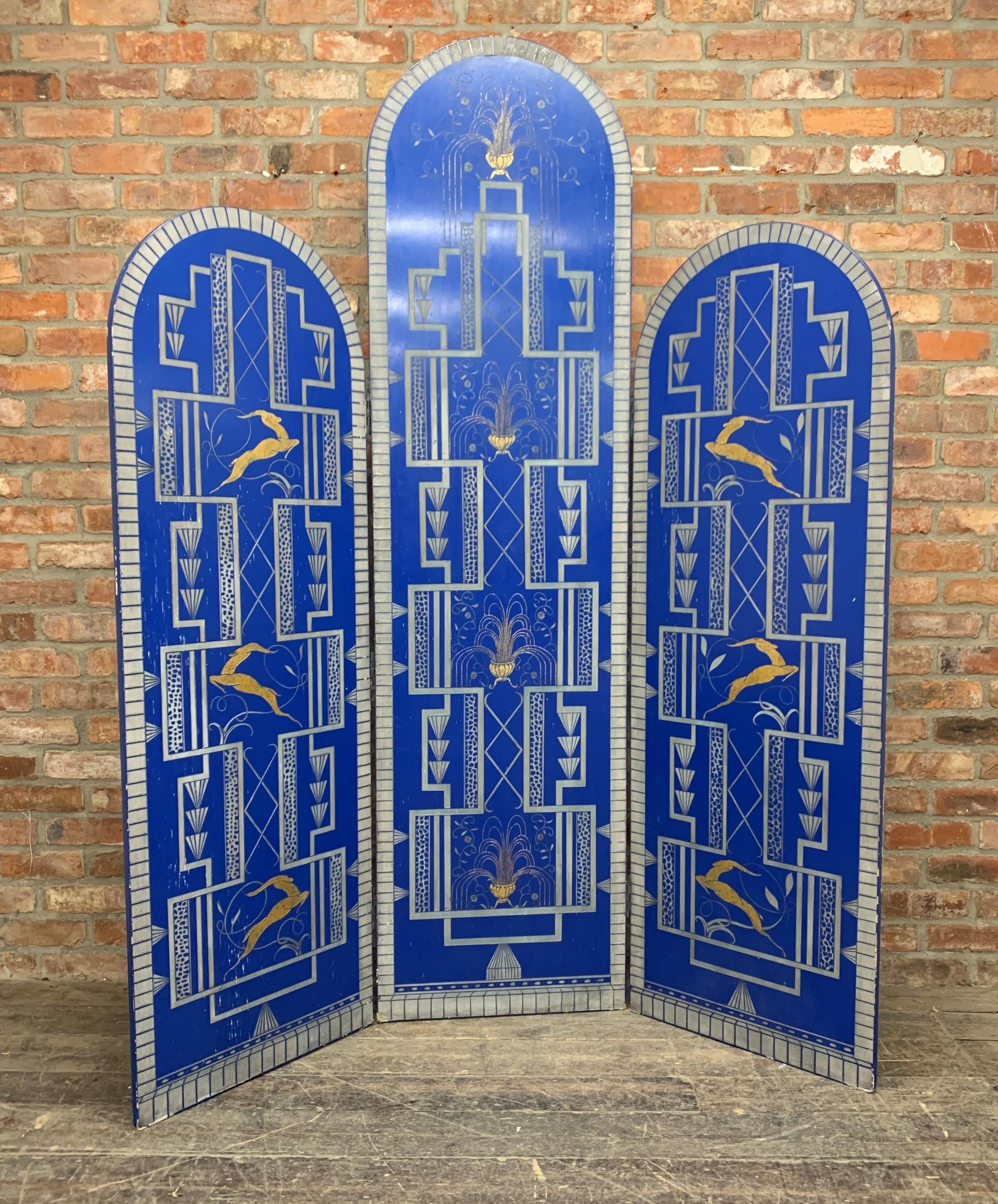 Cool Art Deco three fold screen, incised with gilt leaping gazelles and fountains, 230cm high