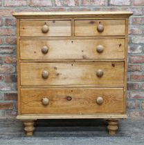 Victorian stripped pine chest of two short over three long drawers with turned wooden handles and