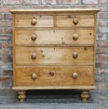 Victorian stripped pine chest of two short over three long drawers with turned wooden handles and