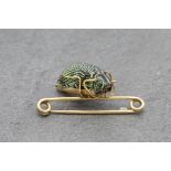 18ct petrified Scarab Beetle brooch, 4.5cm long, 4g