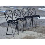 A set of four painted iron garden chairs with scrollwork detail, H 81cm (4)