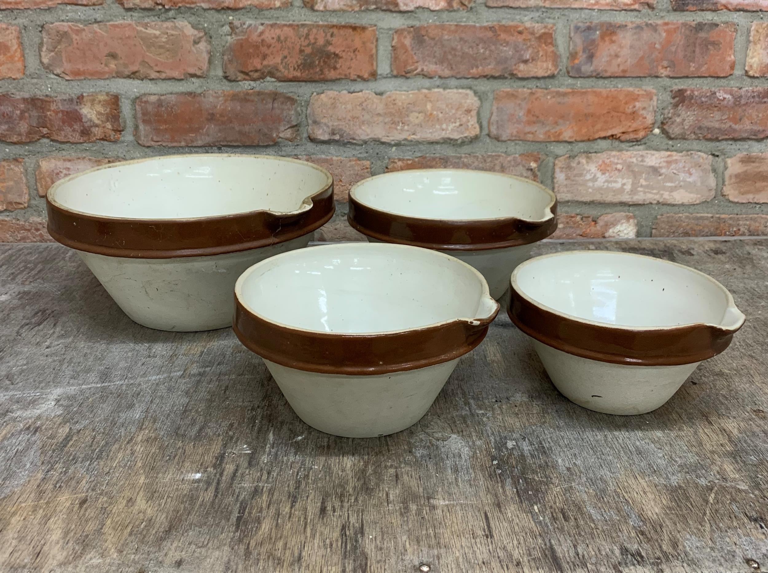 Set of four graduated glaze terracotta spouted dairy bowls, the largest H 14cm x D 31cm