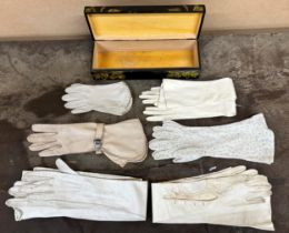 Painted wooden glove box containing antique and vintage gloves including children's and evening