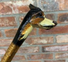 Hand carved wooden Foxhound dog head walking stick with brown glass eyes, probably produced by Brigg