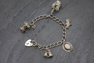 Silver charm bracelet with five charms and heart padlock clasp, 19cm long, 34g