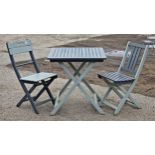 Contemporary painted wooden fold out garden table and two similar chairs, H 73cm x W 70cm x D