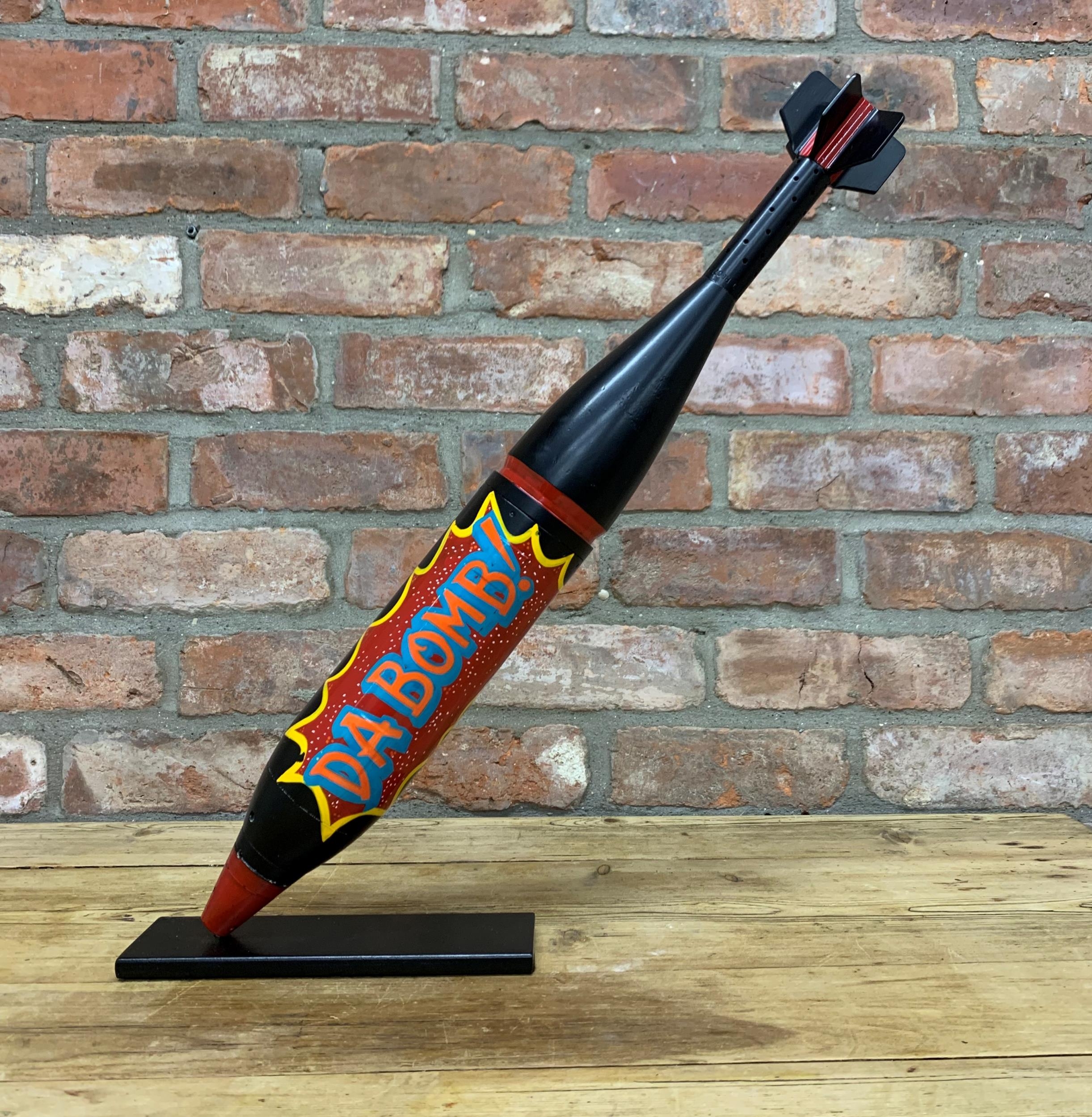 Decommissioned military mortar mounted on base with carnival themed 'Da Bomb' hand painted finish, H