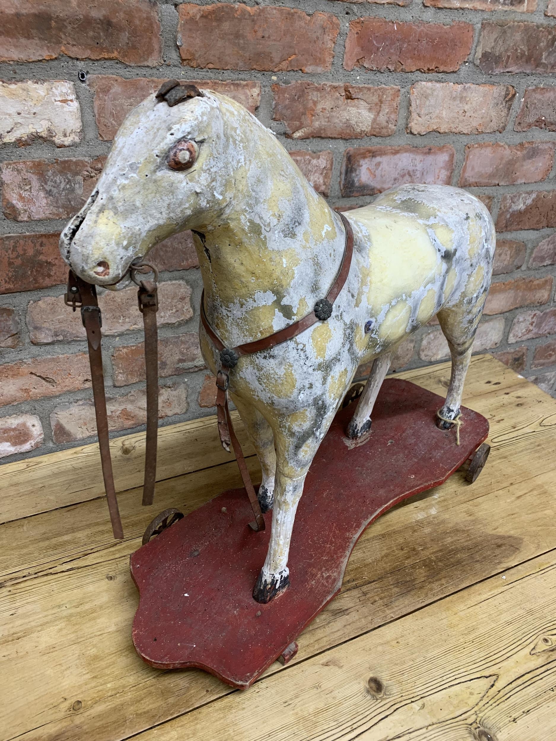 19th century Folk Art pull along horse on iron wheels, original paint, H 58cm x L 67cm - Image 2 of 3