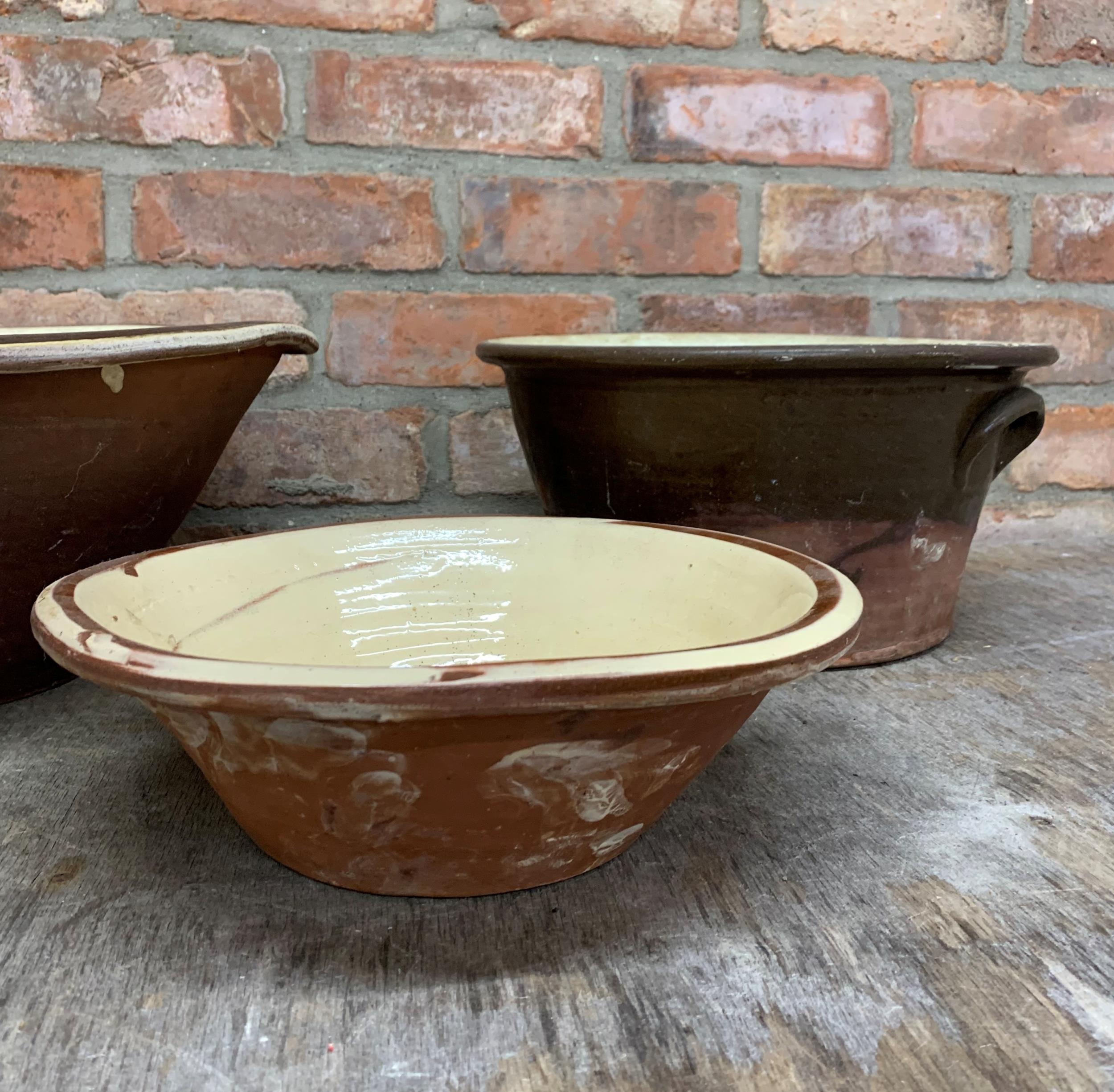 Three graduated glaze terracotta dairy bowls, the largest H 19cm x D 42cm - Image 4 of 4