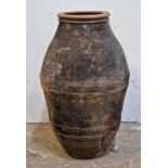 A weathered terracotta amphora with pressed banded detail, H 66cm