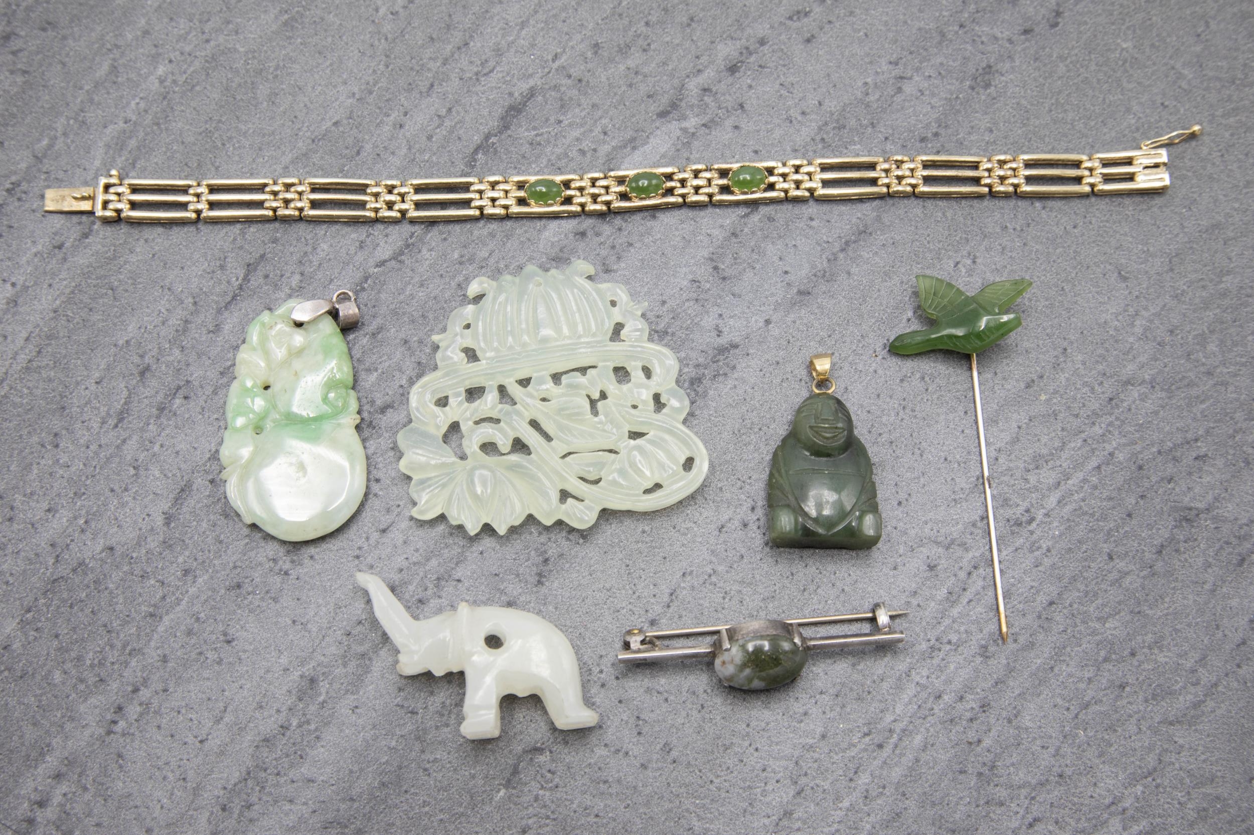 A collection of seven jade jewellery pieces, to include two pendants, bracelet, brooch, stickpin and