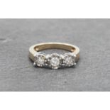 9ct diamond three stone cluster ring, the central stone 0.15ct, size J, 2.6g