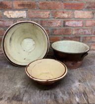 Three graduated glaze terracotta dairy bowls, the largest H 19cm x D 42cm