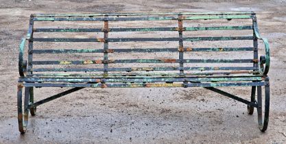 A Victorian iron strapwork three seat garden bench with distressed paintwork, H 80cm x W 180cm x D