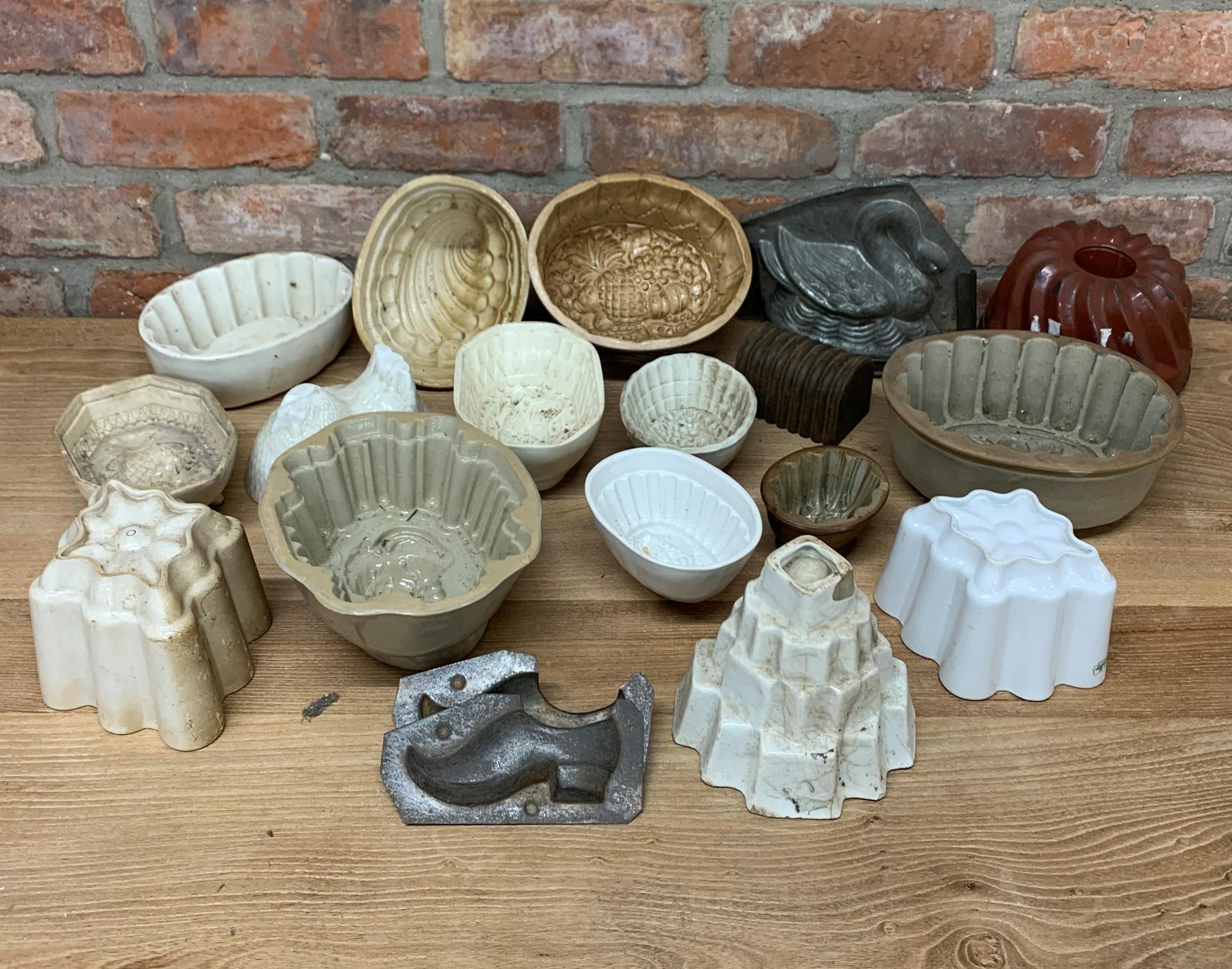 Large collection of ceramic and metal jelly moulds (18)