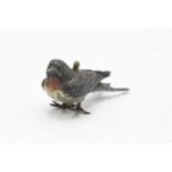 Austrian cold painted novelty tape measure of a robin, working measuring tape inscribed 'London,