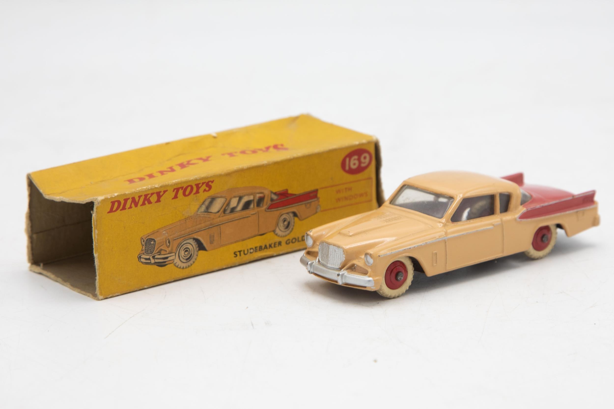 Dinky Toys 169 Studebaker Golden Hawk, two tone red and beige body, missing end flaps one end,