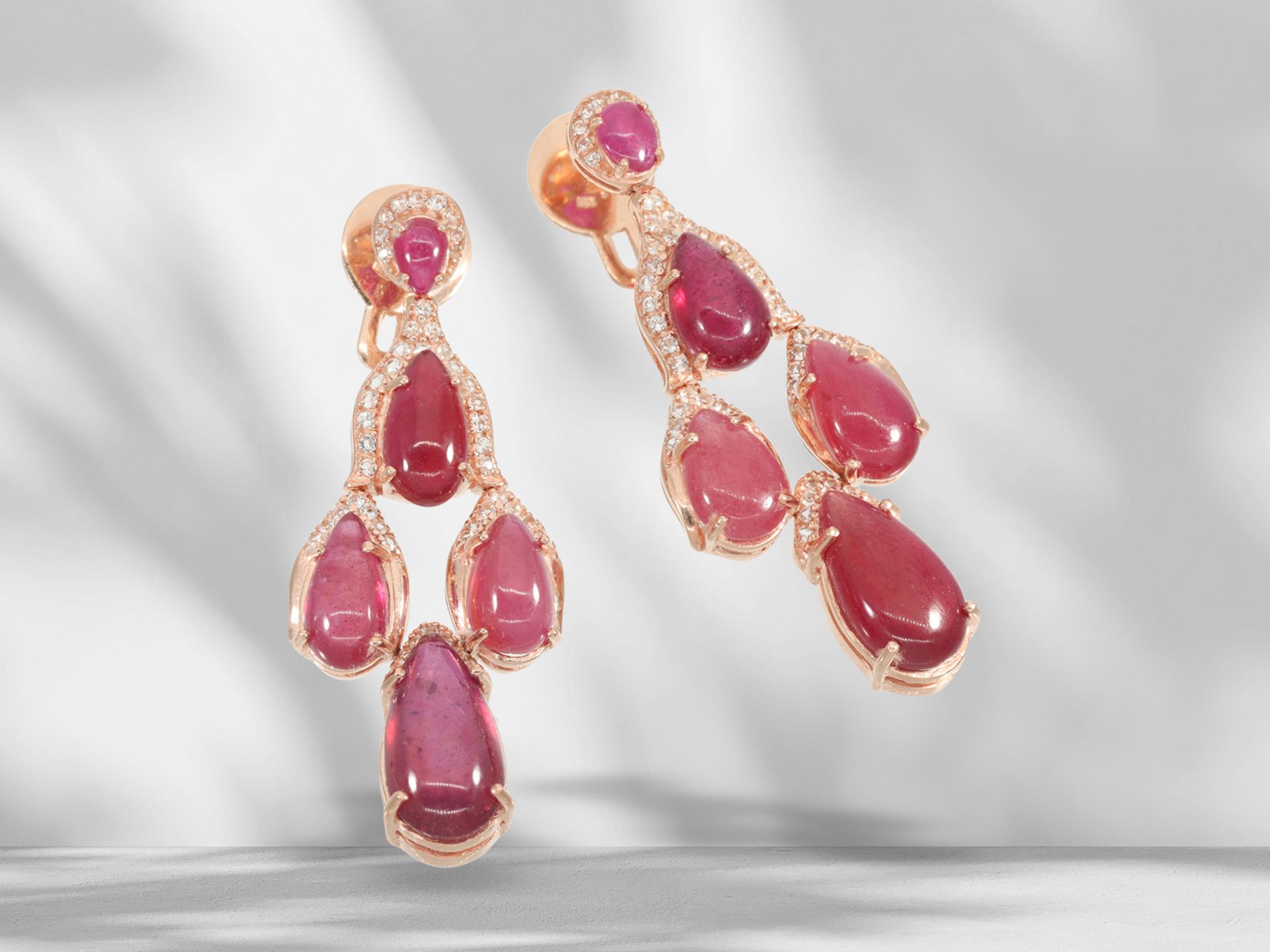 Extremely attractive, like new earrings with rubies and white topazes, silver gilt