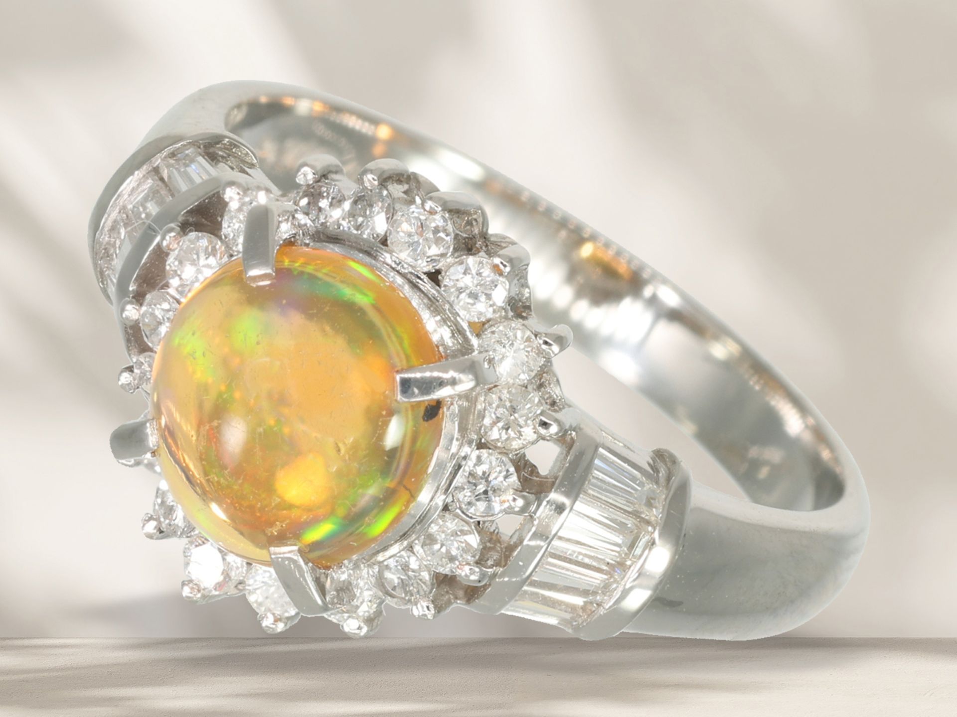 Ring: modern, like new platinum ring with fire opal and brilliant-cut diamonds