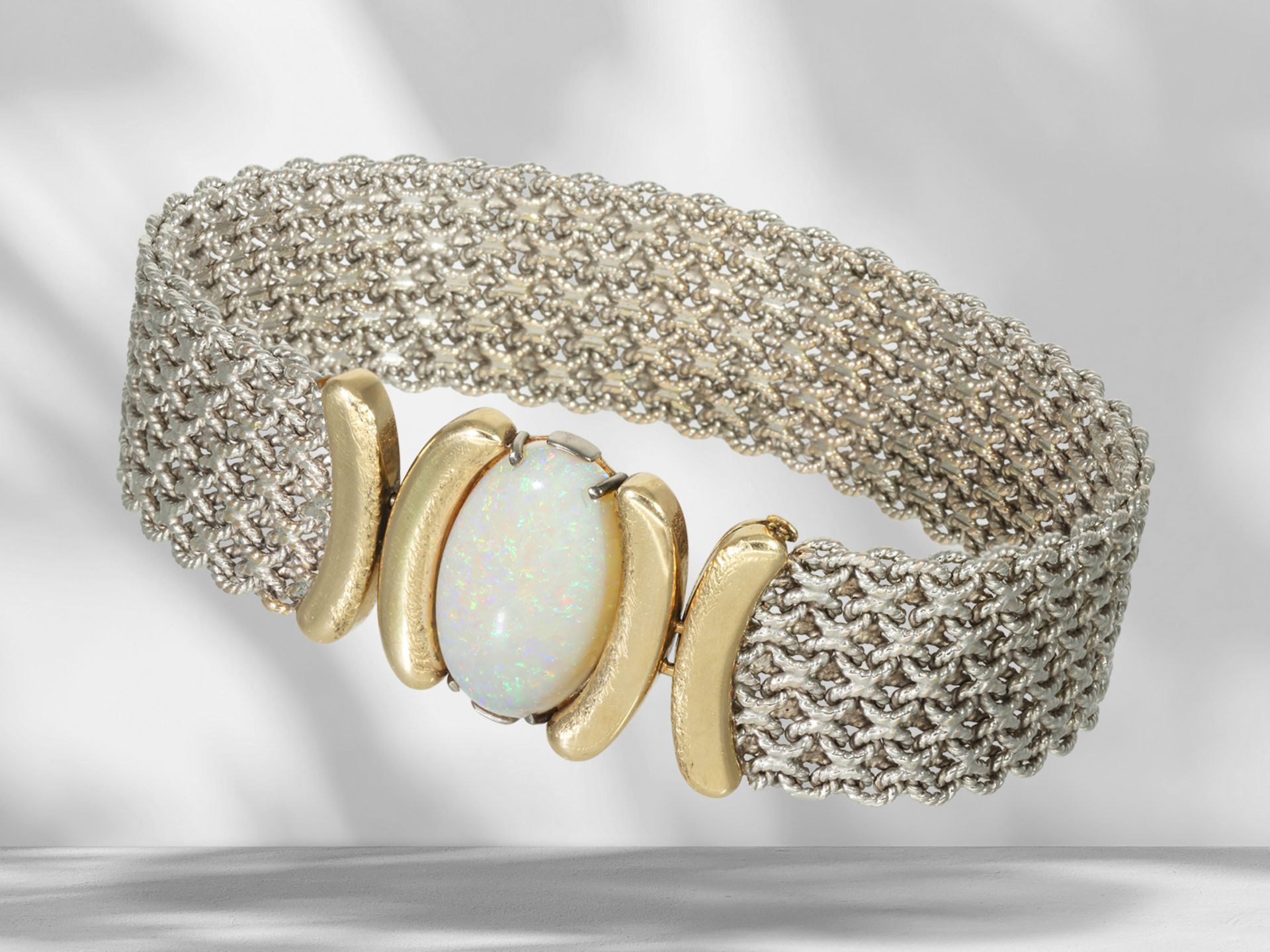 Attractive, heavy and handcrafted bicolour designer bracelet with opal setting