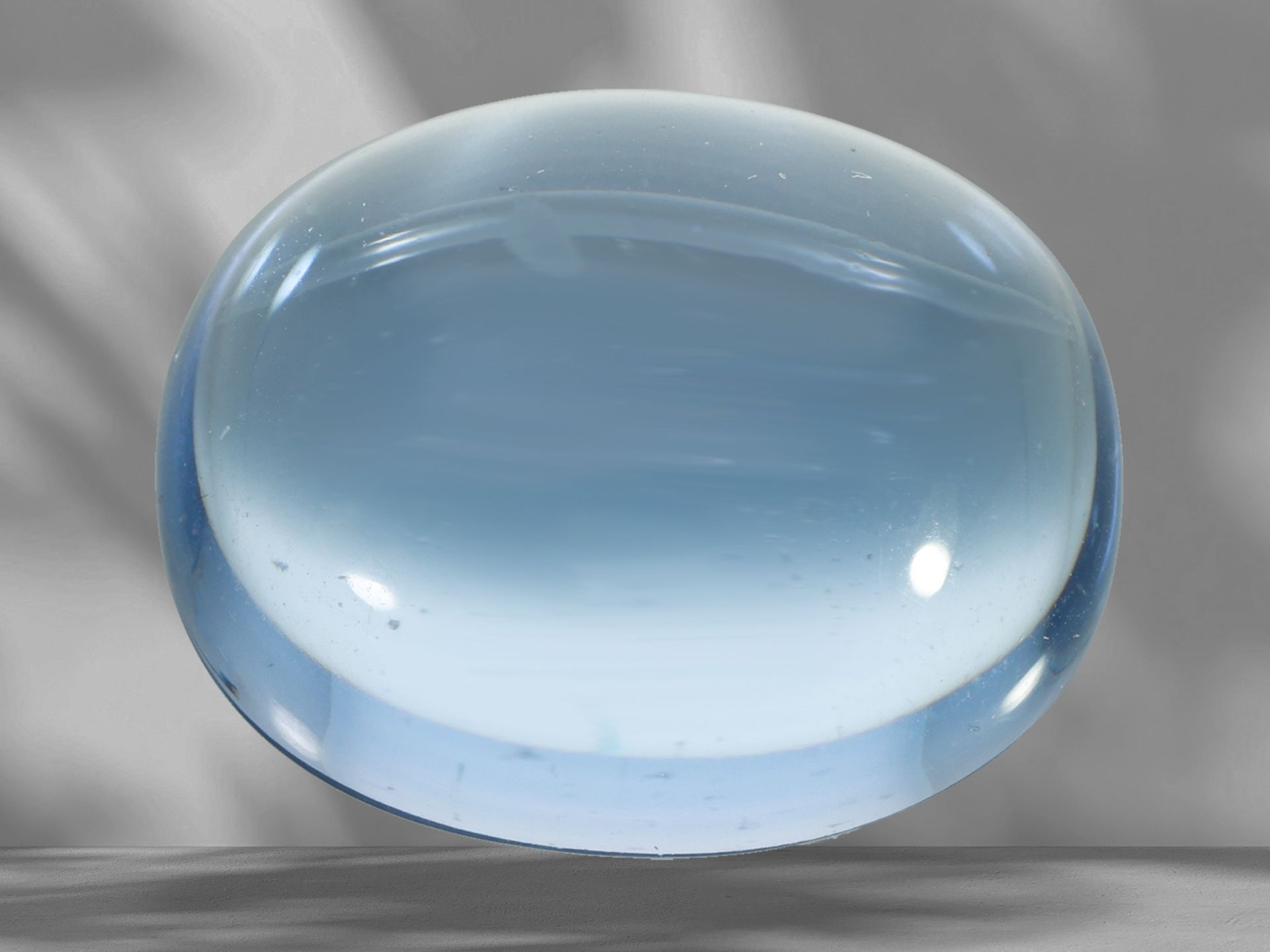 Loose natural maxixe beryl in oval cabochon cut, 24.6ct, blue-light, including SGR report