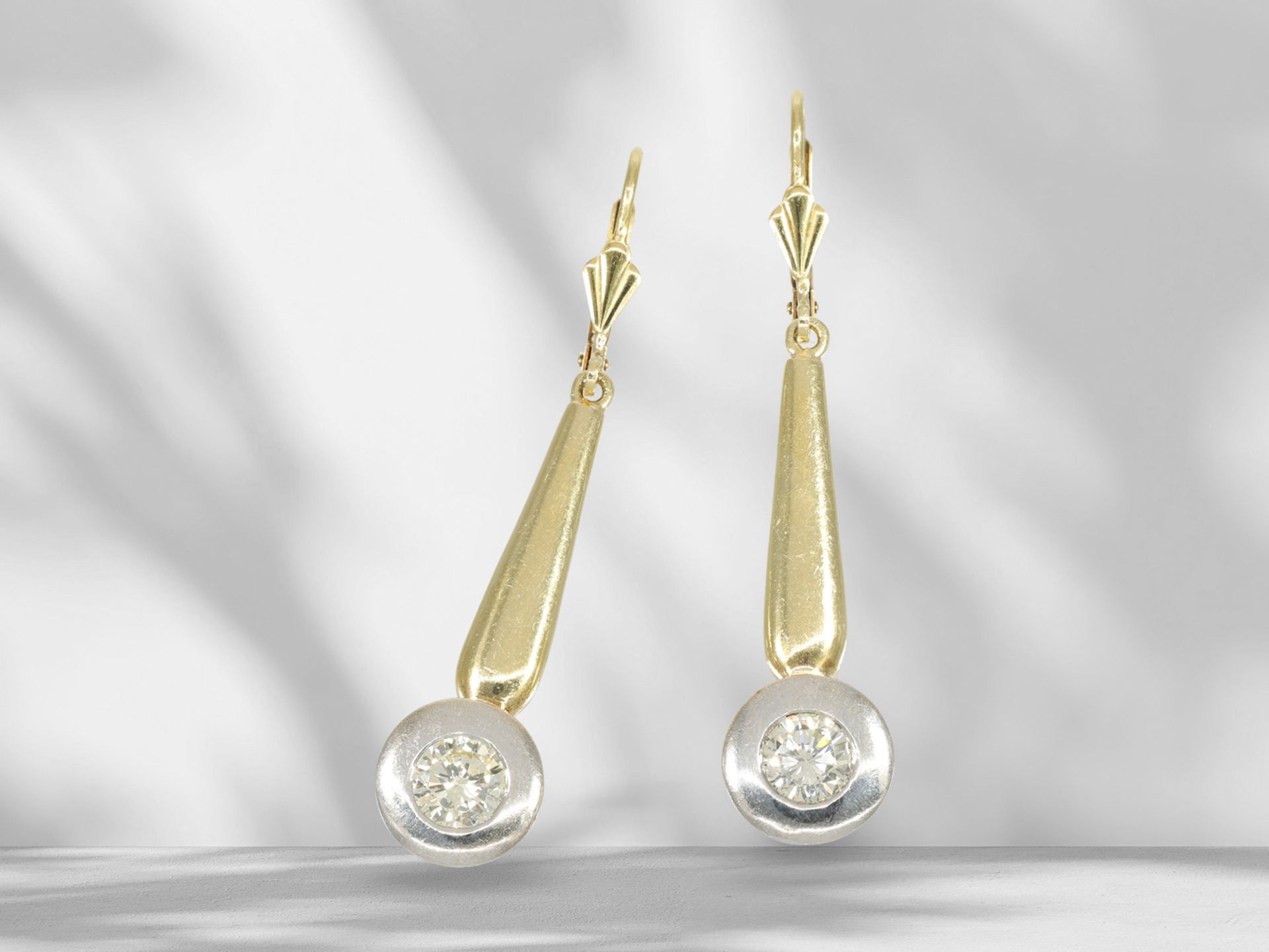 Decorative brilliant-cut diamond solitaire earrings with 2 half-carat diamonds